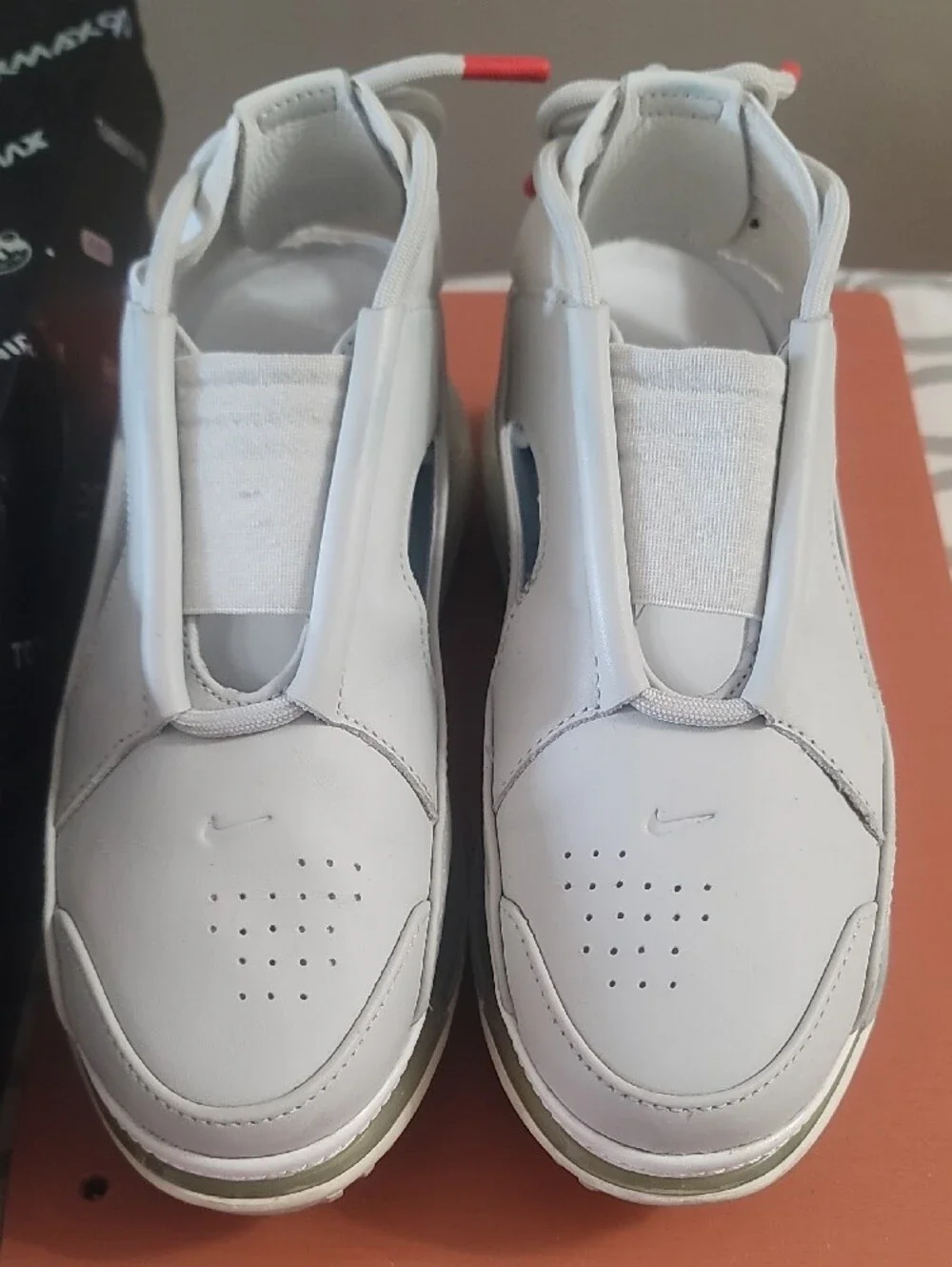 Nike White Slip-On Sneakers with Black Side Stripe and Red Lace Tips